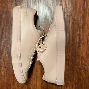 Basically new worn once common projects sneaker. Size 8 mens. It is a size 10 W